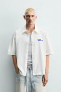 WASHED SHIRT WITH GRAPHIC PRINTS